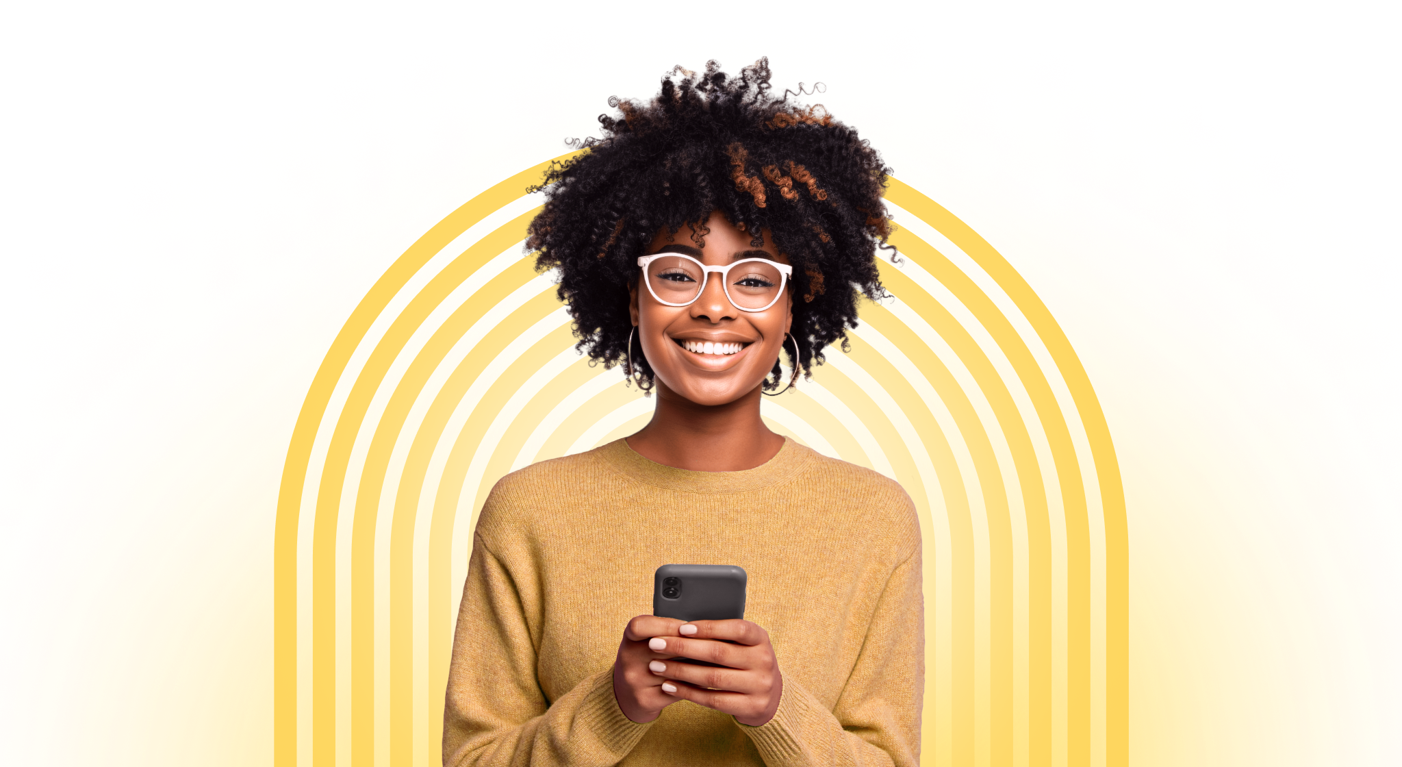 A woman smiling and holding a smartphone.